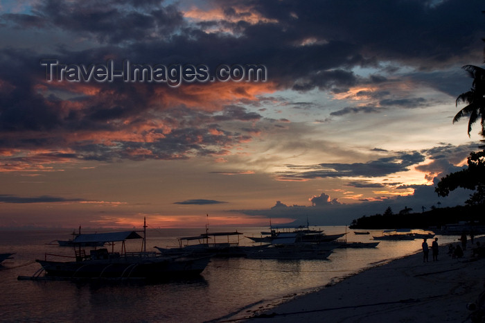 phil47: Alona Beach, Bohol island, Central Visayas, Philippines: boats on the beach with storm clouds at sunset - photo by S.Egeberg - (c) Travel-Images.com - Stock Photography agency - Image Bank
