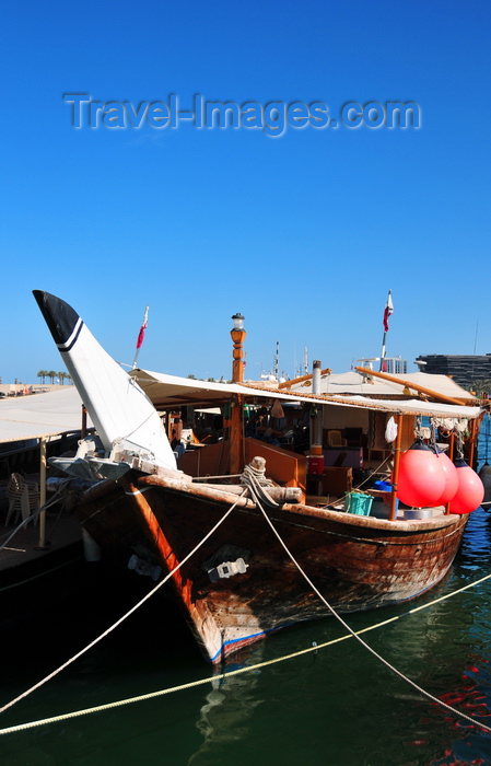 qatar41: Doha, Qatar: dhow with large red buoys - traditional sailing vessels with lateen sails used in the Persian Gulf, Red Sea and Indian Ocean region, now often motorized and without sails - Dhow harbour - photo by M.Torres - (c) Travel-Images.com - Stock Photography agency - Image Bank