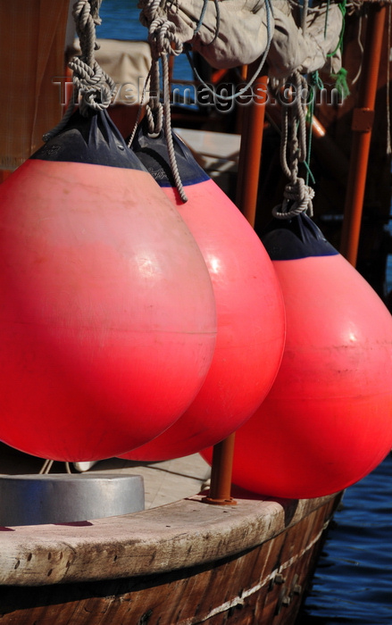 qatar42: Doha, Qatar: large red buoys on a dhow's portside - Dhow harbour - photo by M.Torres - (c) Travel-Images.com - Stock Photography agency - Image Bank