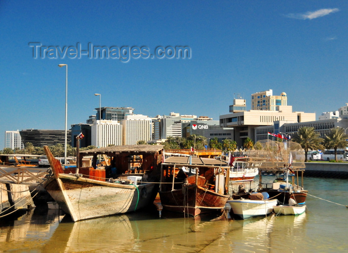 qatar58: Doha, Qatar: dhows wait in the Dhow harbour - view of the south end of the Corniche from the Ministry of Finance to the Sultan Bin Abdullah Al-Asiri tower - photo by M.Torres - (c) Travel-Images.com - Stock Photography agency - Image Bank