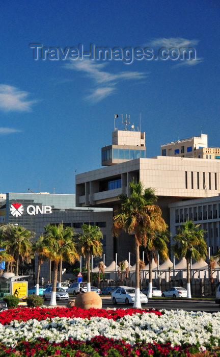 qatar60: Doha, Qatar: red and white flowers and the Ministry of Finance, Al Corniche - photo by M.Torres - (c) Travel-Images.com - Stock Photography agency - Image Bank