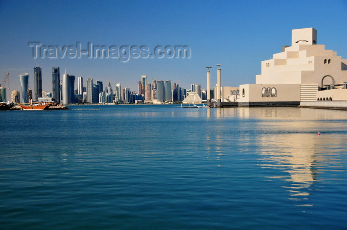 qatar62: Doha, Qatar: Museum of Islamic Art reflected on the bay and the West Bay skyscrapers - photo by M.Torres - (c) Travel-Images.com - Stock Photography agency - Image Bank