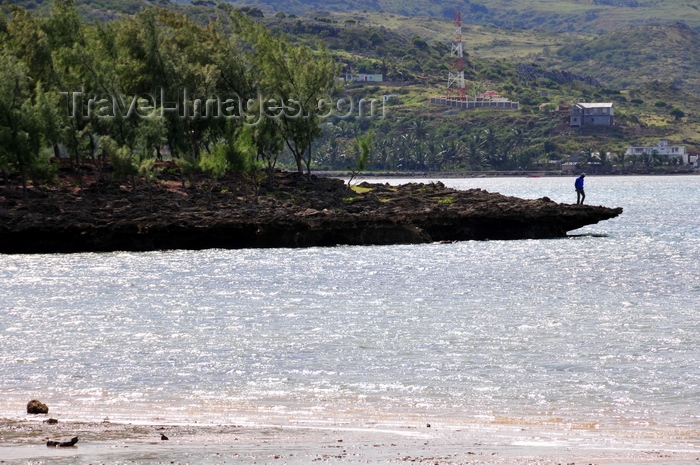 rodrigues4: Anse Grand Var, Rodrigues island, Mauritius: man at the end of an eroded and windswept rock promontory - photo by M.Torres - (c) Travel-Images.com - Stock Photography agency - Image Bank