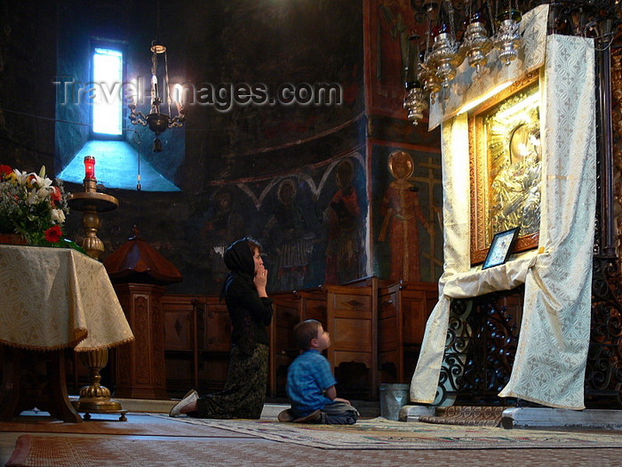 romania123: Târgu Neamt area, Neamt county, Moldavia, Romania: prayer in Neamt Monastery - mother and child in front of icon of the Virgin and baby Jesus - photo by J.Kaman - (c) Travel-Images.com - Stock Photography agency - Image Bank