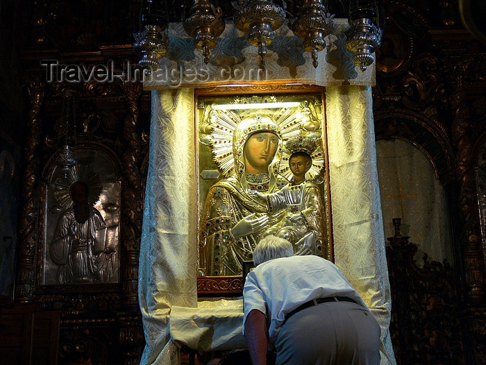 romania124: Târgu Neamt area, Neamt county, Moldavia, Romania: Neamt Monastery - man kisses the miracle-maker holy icon of the Virgin and baby Jesus - photo by J.Kaman - (c) Travel-Images.com - Stock Photography agency - Image Bank