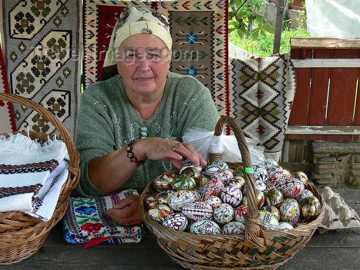 romania29: Gura Humorului, Suceava county, southern Bukovina, Romania: decorated eggs and textiles - woman at souvenir stall - photo by J.Kaman - (c) Travel-Images.com - Stock Photography agency - Image Bank