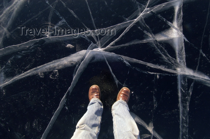 russia754: Lake Baikal, Irkutsk oblast, Siberian Federal District, Russia: cracks on the frozen surface - ice and legs - photo by B.Cain - (c) Travel-Images.com - Stock Photography agency - Image Bank