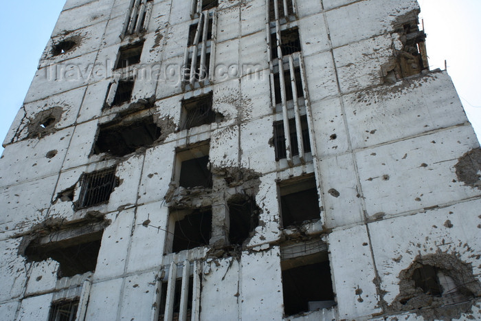 russia790: Chechnya, Russia - Grozny - destroyed building - war scars - artillery impacts - photo by A.Bley - (c) Travel-Images.com - Stock Photography agency - Image Bank