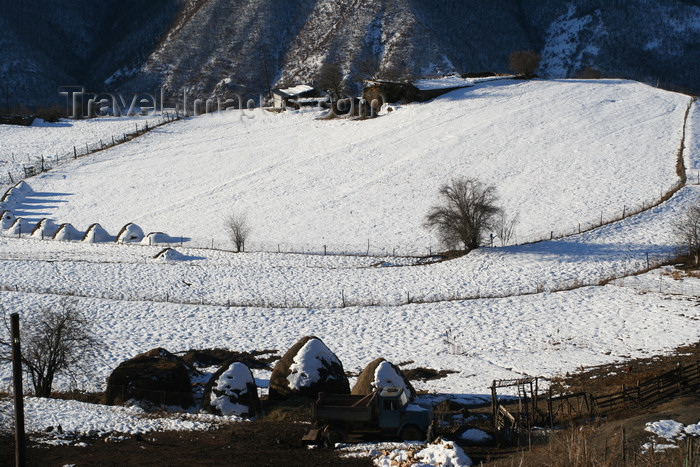russia798: Chechnya, Russia - landscape in winter with snow and mountains - farm house and haystacks - photo by A.Bley - (c) Travel-Images.com - Stock Photography agency - Image Bank