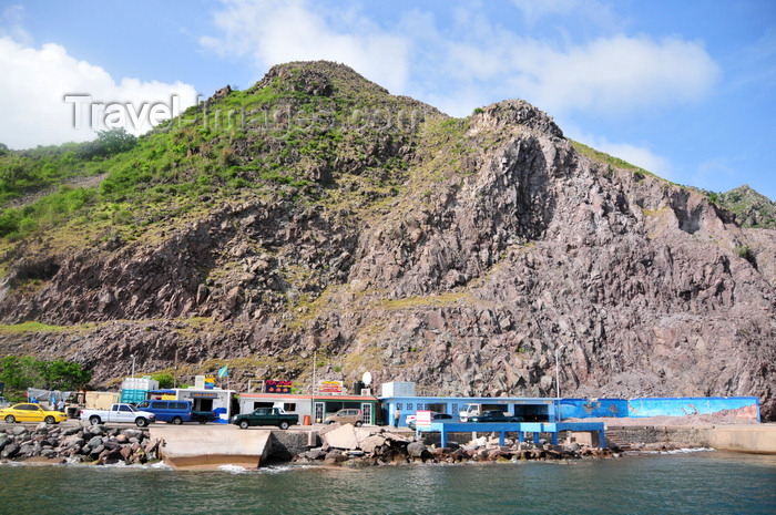 saba49: Fort Bay, Saba: harbour buildings and unstable rock slope - dive shops - photo by M.Torres - (c) Travel-Images.com - Stock Photography agency - Image Bank