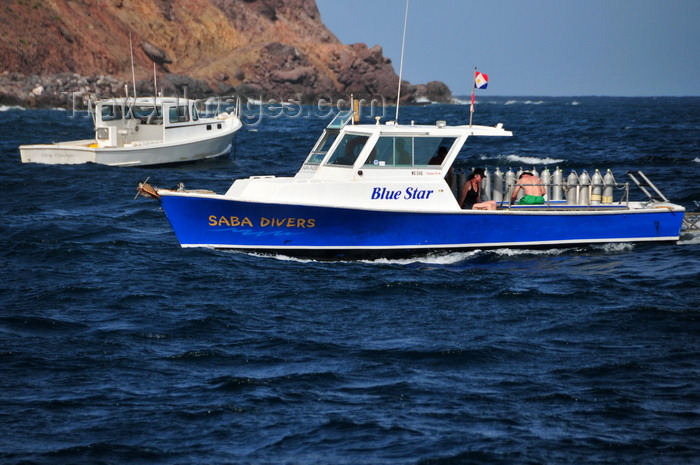 saba50: Fort Bay, Saba: Saba Divers - the Blue star returns to the harbour - Saba is one world's top Scuba diving destinations - photo by M.Torres - (c) Travel-Images.com - Stock Photography agency - Image Bank