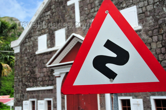 saba57: The Bottom, Saba: Sacred Heart Church and winding road ahead sign, alerting for the dangers of Josephus Lambert Hassell's 'The Road' - photo by M.Torres - (c) Travel-Images.com - Stock Photography agency - Image Bank