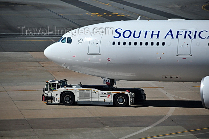 safrica246: Johannesburg, Gauteng, South Africa: South African Airways Airbus A330-243 ZS-SXX (ex F-WWYL), cn 1223 with Goldhofer AST-1 Towbarless Tug operated by Swissport - OR Tambo International / Johannesburg International Airport / Jan Smuts / JNB - Kempton Park, Ekurhuleni - photo by M.Torres - (c) Travel-Images.com - Stock Photography agency - Image Bank