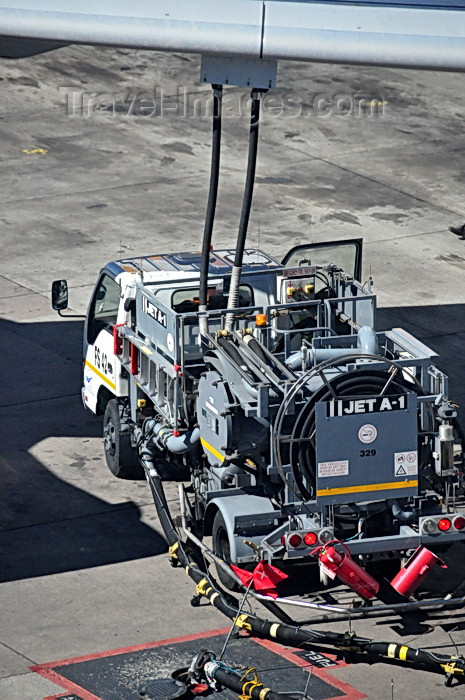 safrica248: Johannesburg, Gauteng, South Africa: aviation fuel truck refuelling an Airbus A340 - underground fuel pipes allow refuelling without a tank - Jet A-1 - OR Tambo International / Johannesburg International Airport / Jan Smuts / JNB - Kempton Park, Ekurhuleni - photo by M.Torres - (c) Travel-Images.com - Stock Photography agency - Image Bank