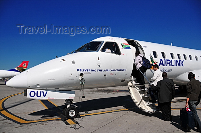 safrica253: Johannesburg, Gauteng, South Africa: Airlink Embraer EMB-135LR (ERJ-135LR) ZS-OUV cn 145493 - on the nose 'Delivering the African century - OR Tambo International / Johannesburg International Airport / Jan Smuts / JNB - Kempton Park, Ekurhuleni - photo by M.Torres - (c) Travel-Images.com - Stock Photography agency - Image Bank