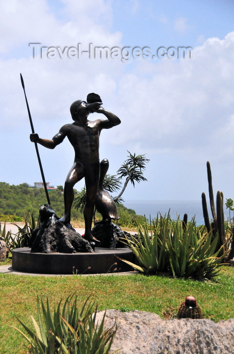 saint-barthelemy30: Col de la Tourmente, St. Barts / Saint-Barthélemy: Arawak warrior armed with a lance and sounding a conch shell - pelican and iguana - photo by M.Torres - (c) Travel-Images.com - Stock Photography agency - Image Bank