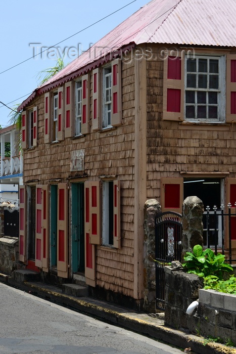 saint-kitts-nevis60: Charlestown, Nevis, St Kitts and Nevis: Creole architecture - building with zinc roof and shingles on the facade - Government Road - photo by M.Torres - (c) Travel-Images.com - Stock Photography agency - Image Bank