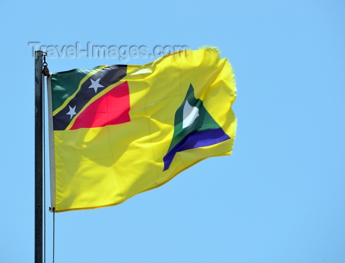 saint-kitts-nevis62: Charlestown, Nevis, St Kitts and Nevis: Nevis flag, representing the peak, with clouds above and the Caribbean sea below, in the canton the national flag of St Kitts and Nevis - photo by M.Torres - (c) Travel-Images.com - Stock Photography agency - Image Bank