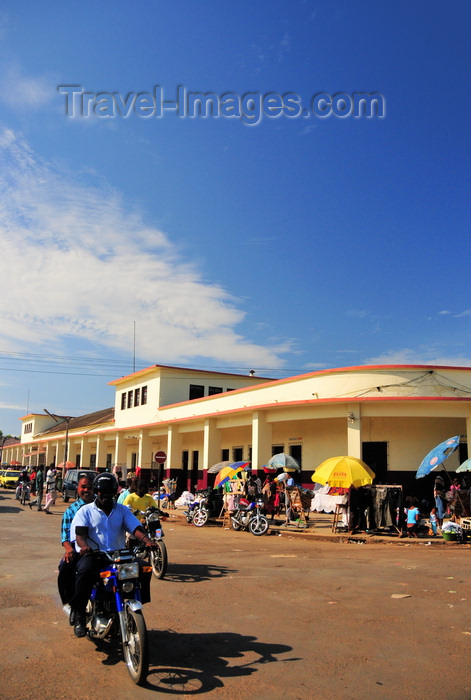 sao-tome257: São Tomé, São Tomé and Príncipe / STP: motorbike passing by the Municipal Market / motorizada junto ao Mercado Municipal - Avenida Conceição - photo by M.Torres - (c) Travel-Images.com - Stock Photography agency - Image Bank