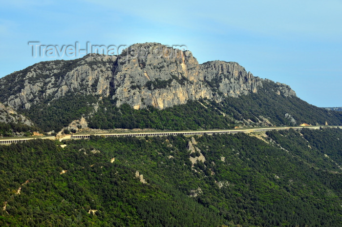 sardinia16: Dorgalia / Durgàli, Nuoro province, Sardinia/ Sardegna / Sardigna: the SS125 road has to be protected by a slab as it goes under a vertical rock wall - imposing limestone cliffs - Strada statale 125 - Via Orientale Sarda - photo by M.Torres - (c) Travel-Images.com - Stock Photography agency - Image Bank