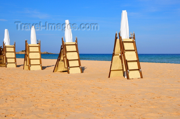 sardinia237: Baia di Chia, Domus de Maria municipality, Cagliari province, Sardinia / Sardegna / Sardigna: beach scene - folded beach chairs and parasols wait for the tourists - photo by M.Torres - (c) Travel-Images.com - Stock Photography agency - Image Bank