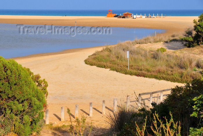 sardinia243: Baia di Chia, Domus de Maria municipality, Cagliari province, Sardinia / Sardegna / Sardigna: lagoon and beach - a thin strip of sand separates the lagoon from the sea - photo by M.Torres - (c) Travel-Images.com - Stock Photography agency - Image Bank