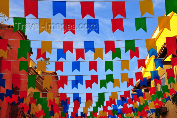 sardinia250: Pula, Cagliari province, Sardinia / Sardegna / Sardigna: street covered in banners - Sant'Efisio celebrations - photo by M.Torres - (c) Travel-Images.com - Stock Photography agency - Image Bank