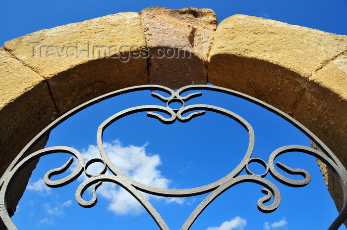 sardinia87: Barumini , Medio Campidano province, Sardinia / Sardegna / Sardigna: Church of the Immaculate Conception - arch and gate detail - an heart or a tomatoe, depending on the beholder - photo by M.Torres - (c) Travel-Images.com - Stock Photography agency - Image Bank