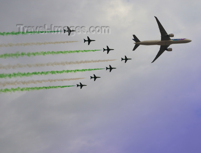 saudi-arabia217: Riyadh, Saudi Arabia: Saudi Hawks aerobatic team flying BAE Hawk Mk.65 jet trainers flying in formation with a Saudi Arabian Airlines Boeing 777-368(ER) HZ-AK43 - Royal Saudi Air Force - photo by M.Torres - (c) Travel-Images.com - Stock Photography agency - Image Bank