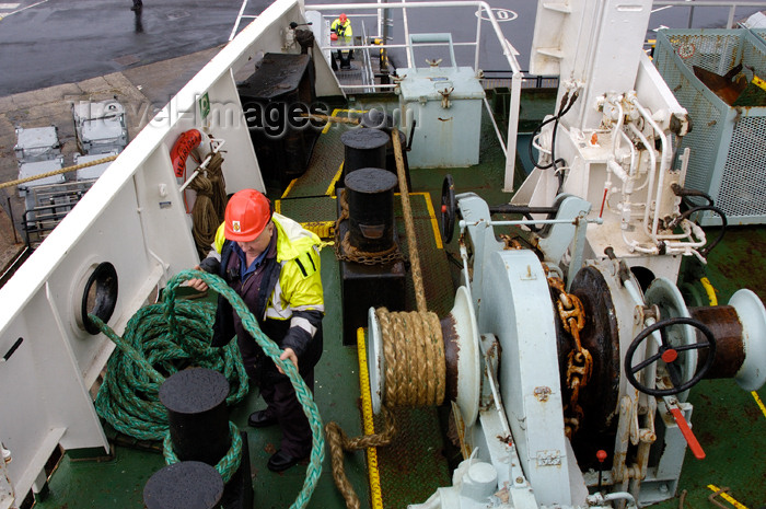 scot173: Scotland - Kennacraig - Argyll - Seaman operating the winch onboard the MV Hebridean Isles preparing to leave port, Scotland outbound for the Isle of Islay. Ferry is operated by Caledonian MacBrayne. - photo by C. McEachern - (c) Travel-Images.com - Stock Photography agency - Image Bank