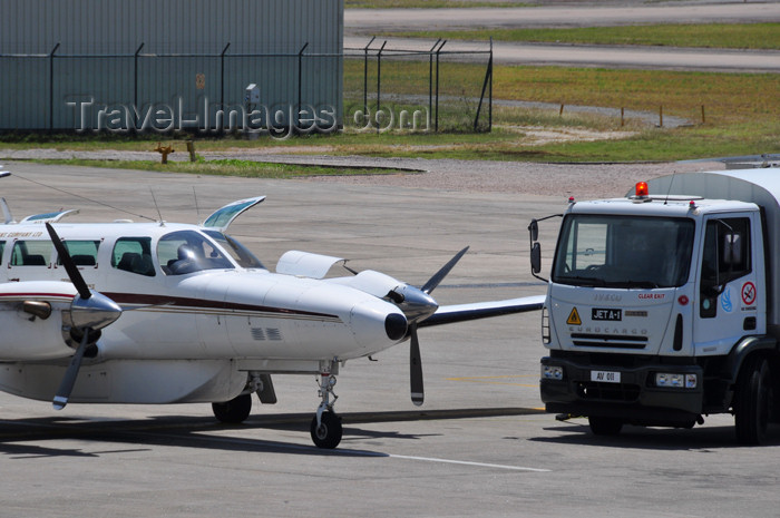 seychelles153: Mahe, Seychelles: Reims F406 Caravan II - S7-AAI (cn F4060051) being serviced - Islands Development Company - Seychelles International Airport - SEZ - photo by M.Torres - (c) Travel-Images.com - Stock Photography agency - Image Bank