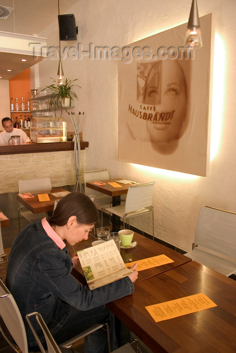 slovenia117: Girl looking at menu in cafe / bar Bistro Ambient, Ljubljana , Slovenia  - photo by I.Middleton - (c) Travel-Images.com - Stock Photography agency - Image Bank