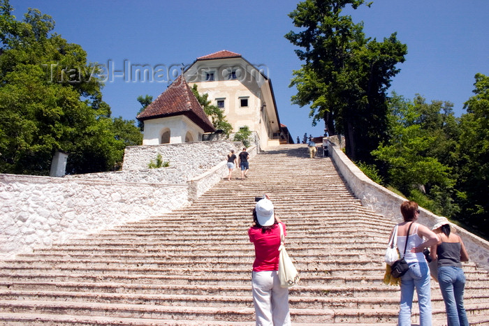 slovenia166: Slovenia - Tourists looking up the 99 steps to the church of the Assumption on Lake Bled - photo by I.Middleton - (c) Travel-Images.com - Stock Photography agency - Image Bank