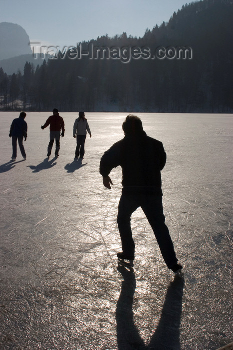 slovenia183: Slovenia - People ice skating across Lake Bled when frozen over in winter - photo by I.Middleton - (c) Travel-Images.com - Stock Photography agency - Image Bank