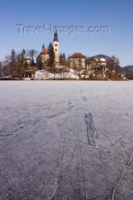 slovenia186: Slovenia - tracks on the ice - frozen lake Bled and the island church of the Assumption of Mary - Cerkev Marijinega vnebovzetja - photo by I.Middleton - (c) Travel-Images.com - Stock Photography agency - Image Bank