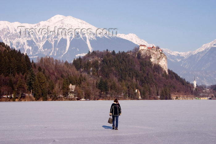 slovenia187: Slovenia - a woman walks across Lake Bled when frozen over in winter - photo by I.Middleton - (c) Travel-Images.com - Stock Photography agency - Image Bank