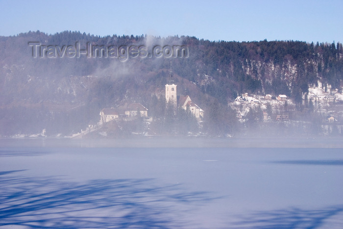 slovenia188: Slovenia - mist - view across to the island church on Lake Bled when frozen over in winter - photo by I.Middleton - (c) Travel-Images.com - Stock Photography agency - Image Bank