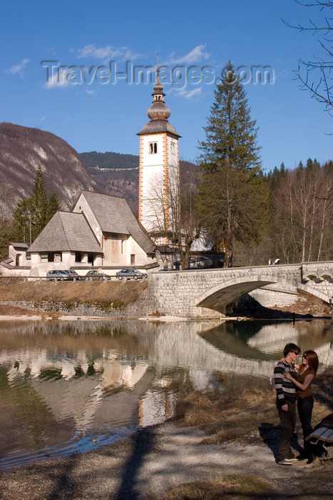 slovenia196: Slovenia - Ribcev Laz - couple, St John's church and bridge - Bohinj Lake in Spring - photo by I.Middleton - (c) Travel-Images.com - Stock Photography agency - Image Bank