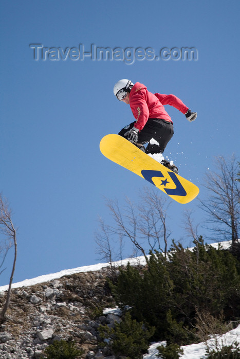 slovenia253: Slovenia - Snowboarder on Vogel mountain in Bohinj - jump with lemon board - photo by I.Middleton - (c) Travel-Images.com - Stock Photography agency - Image Bank