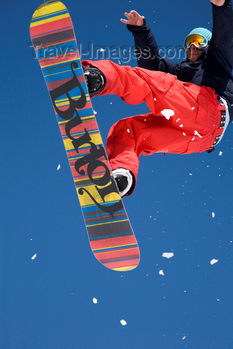 slovenia260: Slovenia - Snowboarder on Vogel mountain in Bohinj - rainbow board - photo by I.Middleton - (c) Travel-Images.com - Stock Photography agency - Image Bank