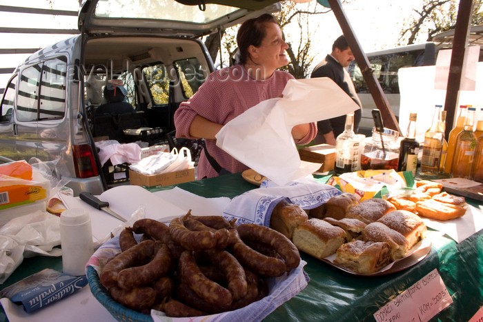 slovenia344: Slovenia - Jance: sausages - woman selling local produce at the Chestnut Sunday festival - photo by I.Middleton - (c) Travel-Images.com - Stock Photography agency - Image Bank
