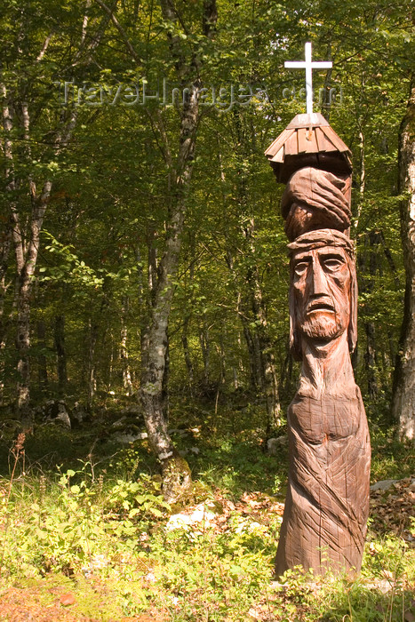 slovenia364: Slovenia - Kocevje - Lower Carniola / Dolenjska region: Wooden carved totem pole for pilgrimage station at Krizev Pot, in hills surrounding Kocevje in southern Slovenia. A pilgrimage set up in memory of the mass killings after WW2. - photo by I.Middleton - (c) Travel-Images.com - Stock Photography agency - Image Bank