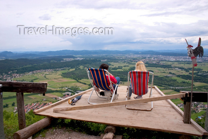 slovenia39: deck chairs - a couple enjoys the view towards the Kamnik Mountains - Smarna Gora mountain on the outskirts of Ljubljana, Slovenia - photo by I.Middleton - (c) Travel-Images.com - Stock Photography agency - Image Bank