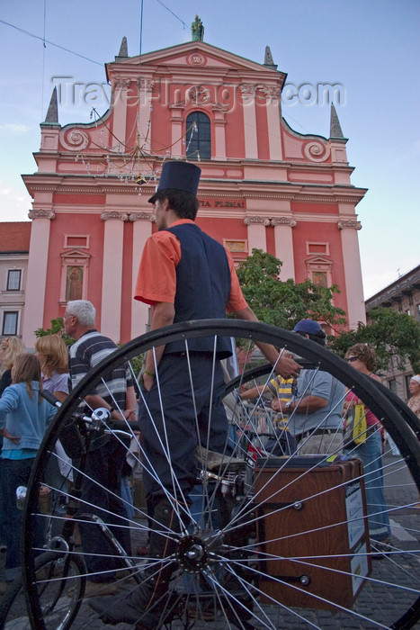 slovenia48: Old fashioned postman and Franciscan Church of the Annunciation, Ljubljana - photo by I.Middleton - (c) Travel-Images.com - Stock Photography agency - Image Bank