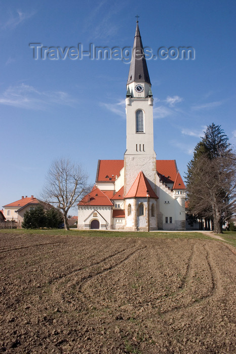 slovenia510: field and Church of Saint Nicholas in Murska Sobota, Prekmurje, Slovenia - photo by I.Middleton - (c) Travel-Images.com - Stock Photography agency - Image Bank