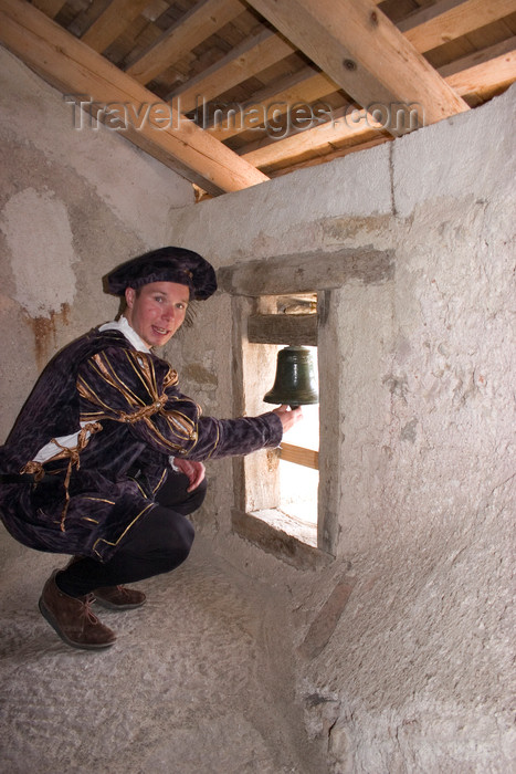 slovenia531: Tour guide ringing wishing bell of Predjama Castle , Slovenia - photo by I.Middleton - (c) Travel-Images.com - Stock Photography agency - Image Bank