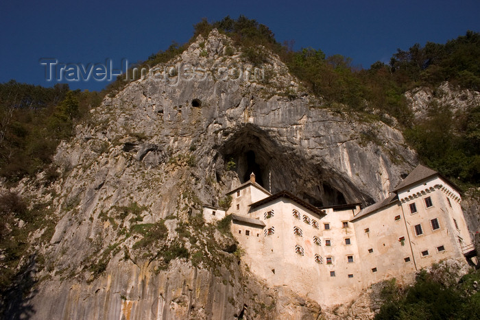 slovenia543: cliff and Predjama castle, Slovenia - photo by I.Middleton - (c) Travel-Images.com - Stock Photography agency - Image Bank