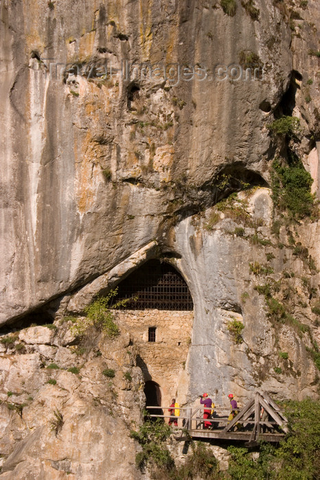 slovenia545: Men going potholing in cave under Predjama castle , Slovenia - photo by I.Middleton - (c) Travel-Images.com - Stock Photography agency - Image Bank