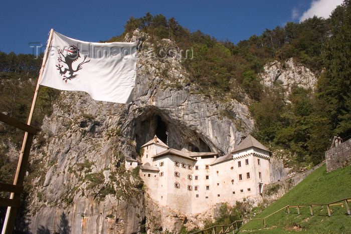 slovenia551: Predjama castle - flag, Slovenia - photo by I.Middleton - (c) Travel-Images.com - Stock Photography agency - Image Bank