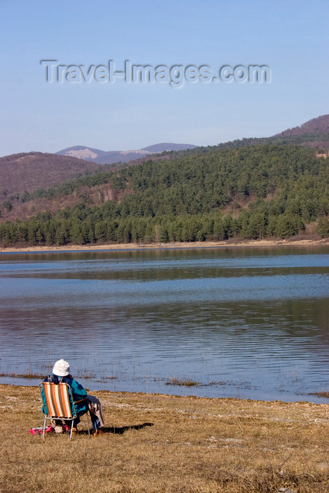 slovenia553: Slovenia - Pivka Valley: woman sitting on deck chair beside Petelinjsko jezero, Pivka intermittent lakes - photo by I.Middleton - (c) Travel-Images.com - Stock Photography agency - Image Bank